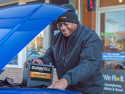 Man installing auto battery