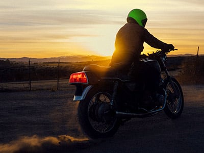 Motorcyclist riding on the road