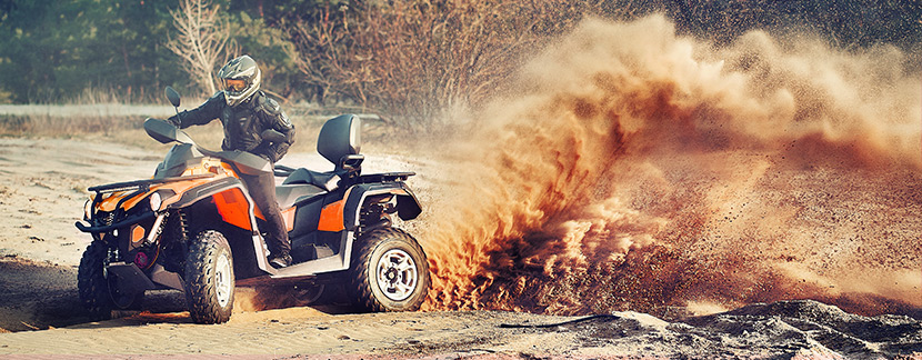 ATV speeding through dirt