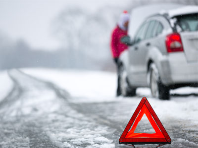 white car on side of the road in winter