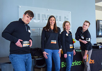 Corporate employees celebrating National Battery Day