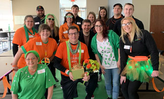 Corporate employees celebrating national battery day